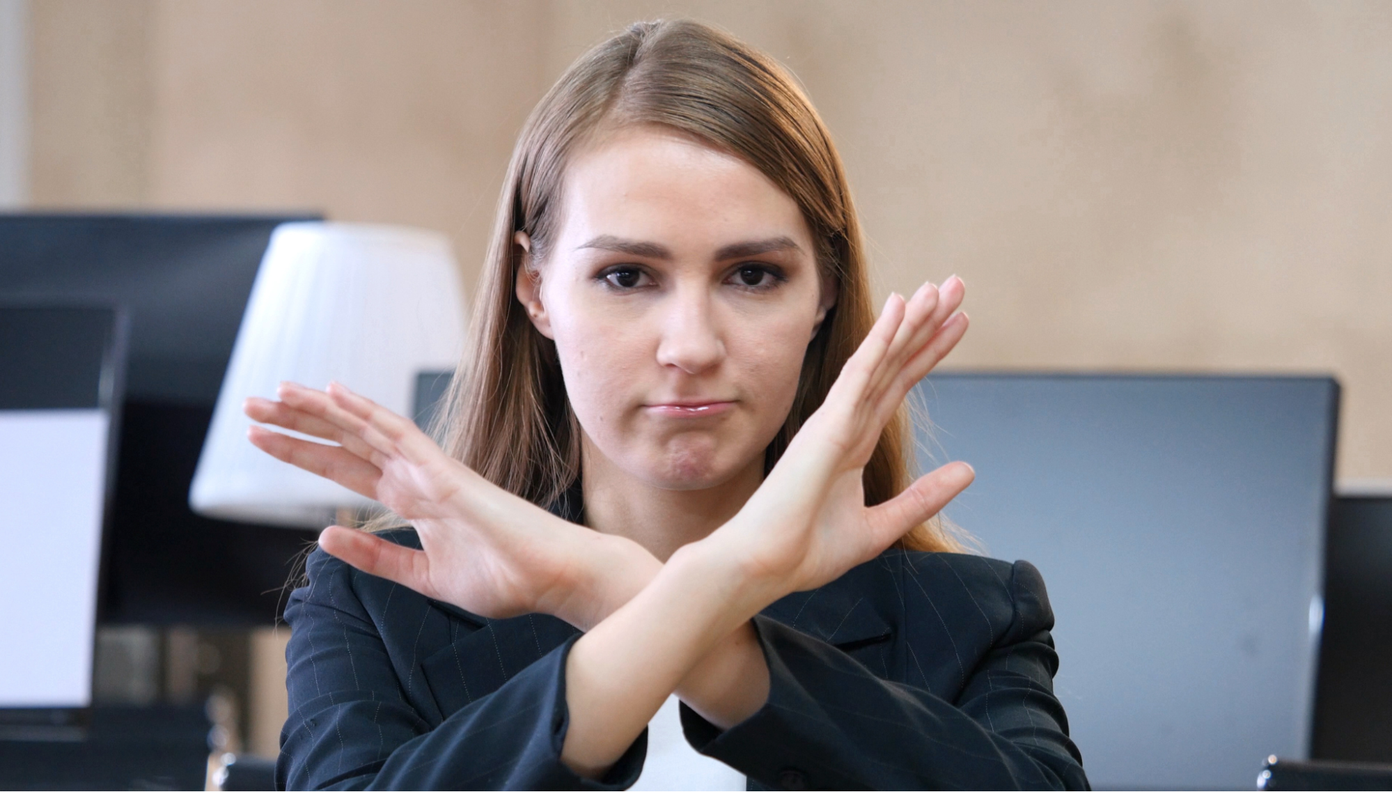 A woman denying when not to outsource live chat support.