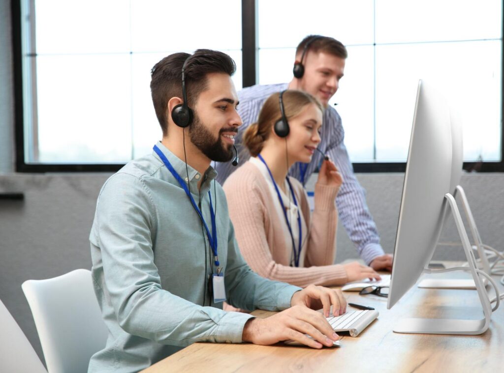 Comparison between in-house support teams and outsourced help desk services for business growth.